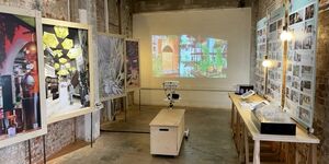 Image of Interior Educators at Bargehouse, with a projector displaying art on the wall.