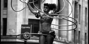 Image of a woman playing with hula hoops.