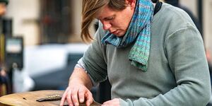 Image of a man playing the guitar.