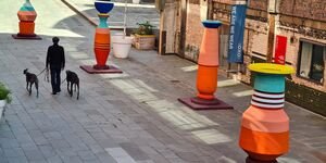 Image of a man walking past an installation.