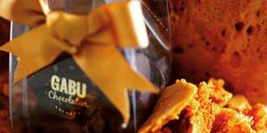 Image of pieces of cookies from Grenada with Gabu Chocolate packaging.
