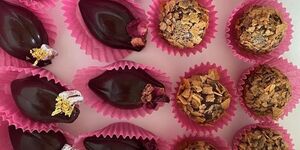 Images of gold chocolate decorated in pink.