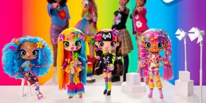 Image of a group of girls pointing at dolls.