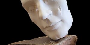 Sculpture of a human face.