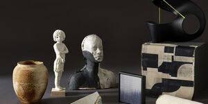 Artwork of a mannequin surrounded by different artwork.