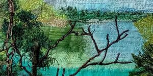 Image of a textile showing a landscape.