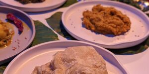 An image of multiple Caribbean dishes surrounded by Christmas decorations.