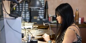 Image of Loveness making jewellery.