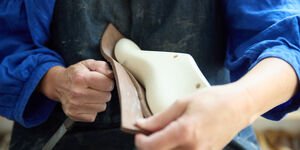 Image of someone making a pair of shoes.