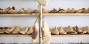Image of a rack of wooden shoes.