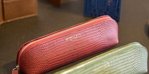 Image of a set of colourful leather pencilcases.
