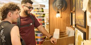 Image of two men browsing a shop.