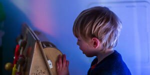 Close up of a young boy playing.