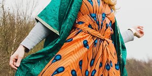 Image of a woman wearing an orange dress.