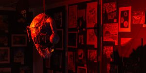 Image of a gallery in red lighting.