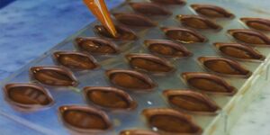 Image of Lisette creating the chocolate.