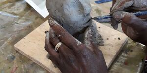 A sculpture of a head in progress