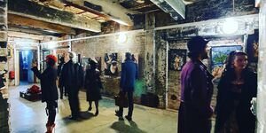 Image of a group of people inside an exhibition.