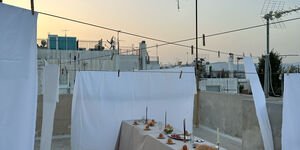 Image of a dining table on a balcony.