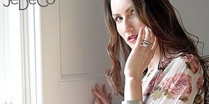 Image of a woman modelling a sculptural ring.