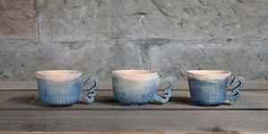 Image of blue ceramic mugs.