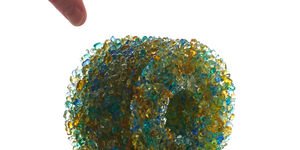 Image of a plastic green circular piece.