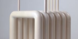 Image of a white wooden armchair.