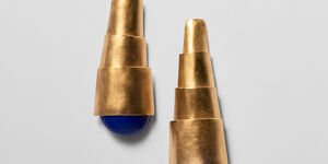 Image of earrings that look like a looking glass.