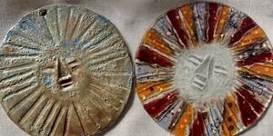 A picture of two ceramic coins.