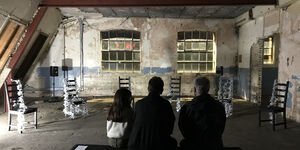 Image of people sat in a gallery.