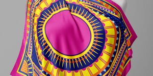 Image of Gina's pink scarf draped over a mannequin.