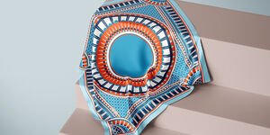 Image of Gina's blue scarf draped over stairs.