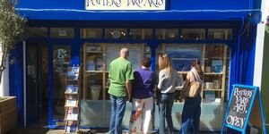 Image of people looking into a shop.