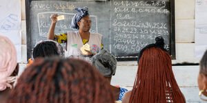 Image of a teacher teaching a class.