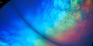 Rainbow colours projected on a screen.