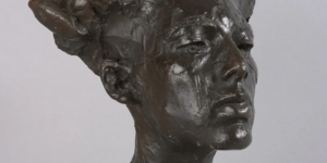 Image of a sculpture of a woman's head.