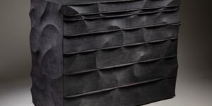 Image of a black block of wood.