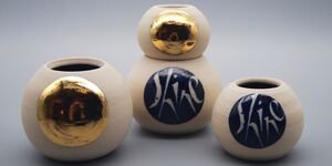 Image of golden ceramic spheres.