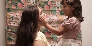 Image of a mother playing with her child.