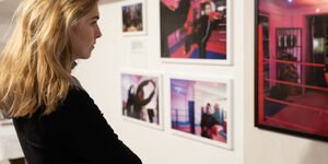 Image of a woman looking at a painting.