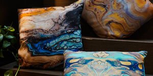 Image of three colourful pillows.