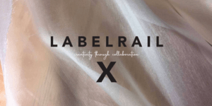 Image of a white cloth with the text 'Label Rail' and logo on top.