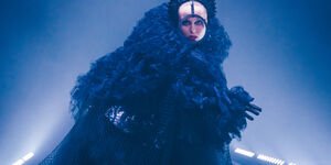 Image of an actor in costume on stage.