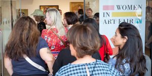 Image of people walking into a gallery.