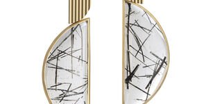 Image of a pair of gold, white and black earrings.