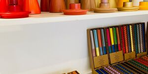 Image of colourful candles and holders.