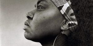 Black and white painting of a woman's side profile.