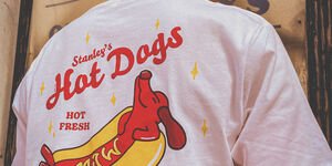 A woman modelling the back of the shirt.