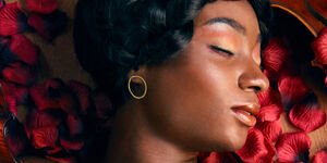 Image of a woman modelling earrings.