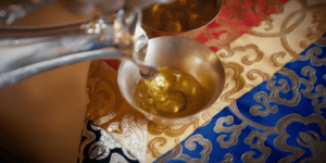 Image of someone pouring tea.